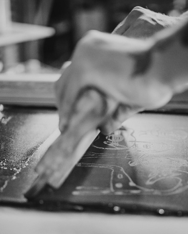 Close up of man doing screen printing