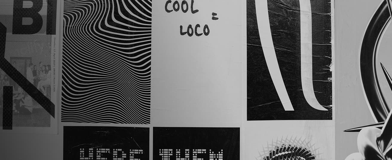 Graphic design posters on a wall.